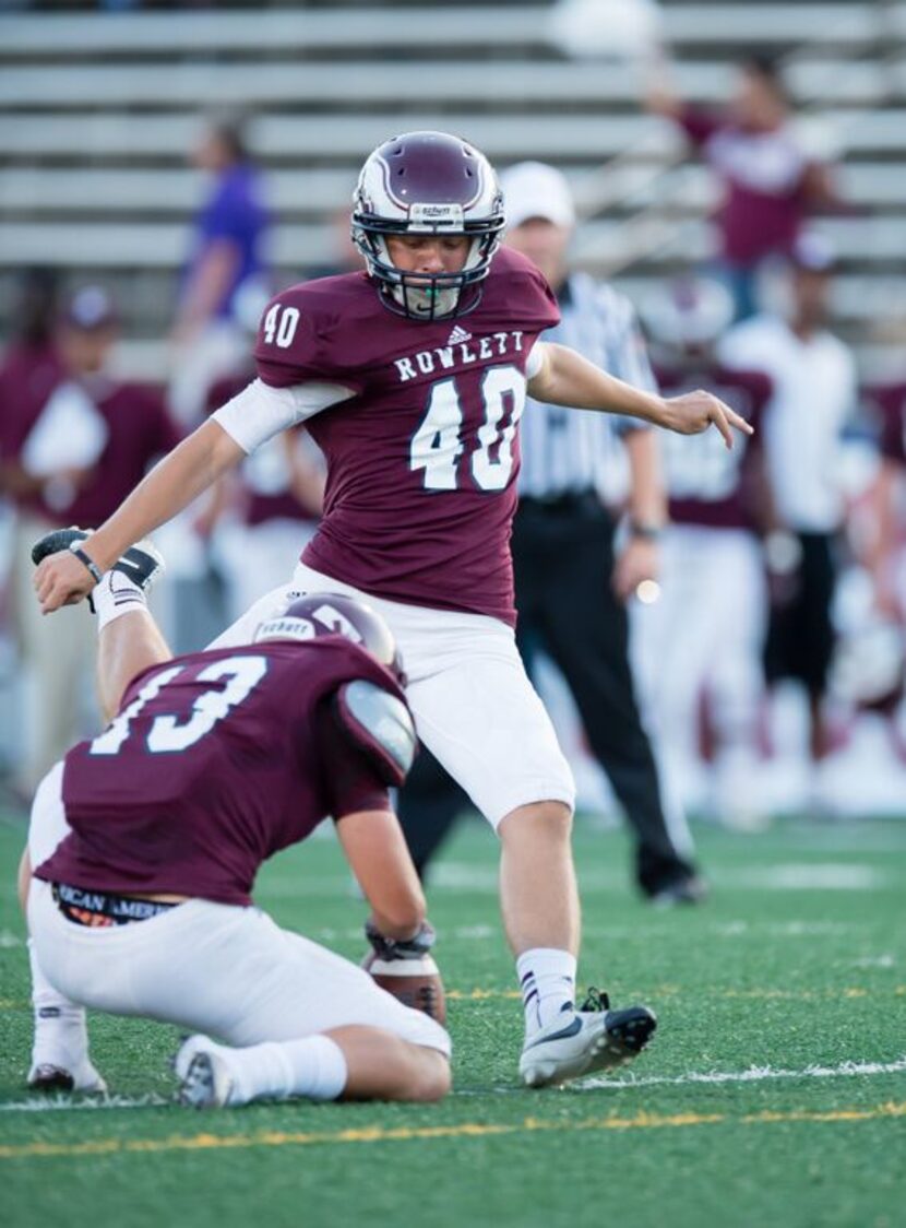 
 Williams kicks the football for Rowlett High School against Lake Highlands High School on...