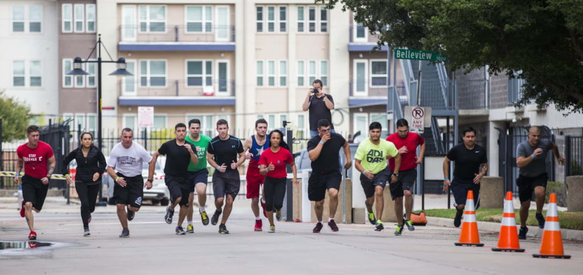 Dallas police officer applicants run a 300-meter time trial while undergoing physical tests...