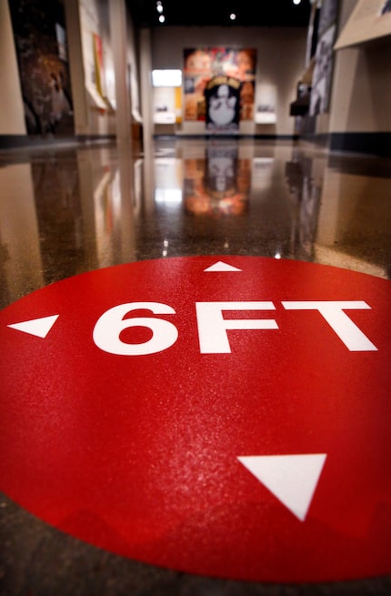 Markers on the floor will remind people to keep 6 ft. spacing while viewing exhibits in the...