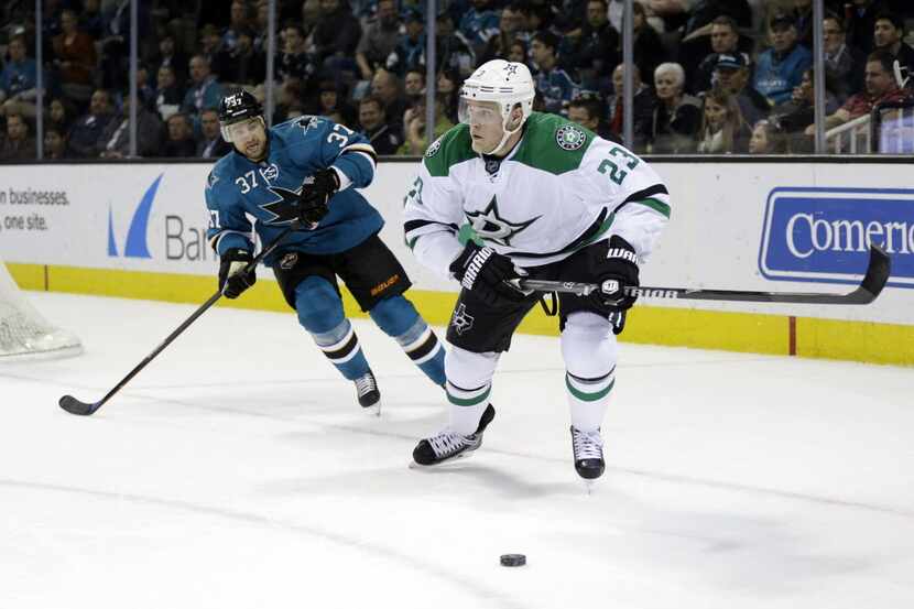 Dallas Stars' Kevin Connauton (23) is chased by San Jose Sharks' Adam Burish (37) during the...
