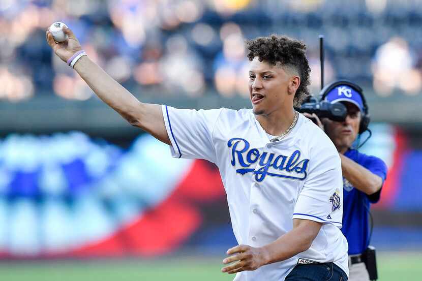 Kansas City Chiefs quarterback Patrick Mahomes throws out the first pitch before Friday's...