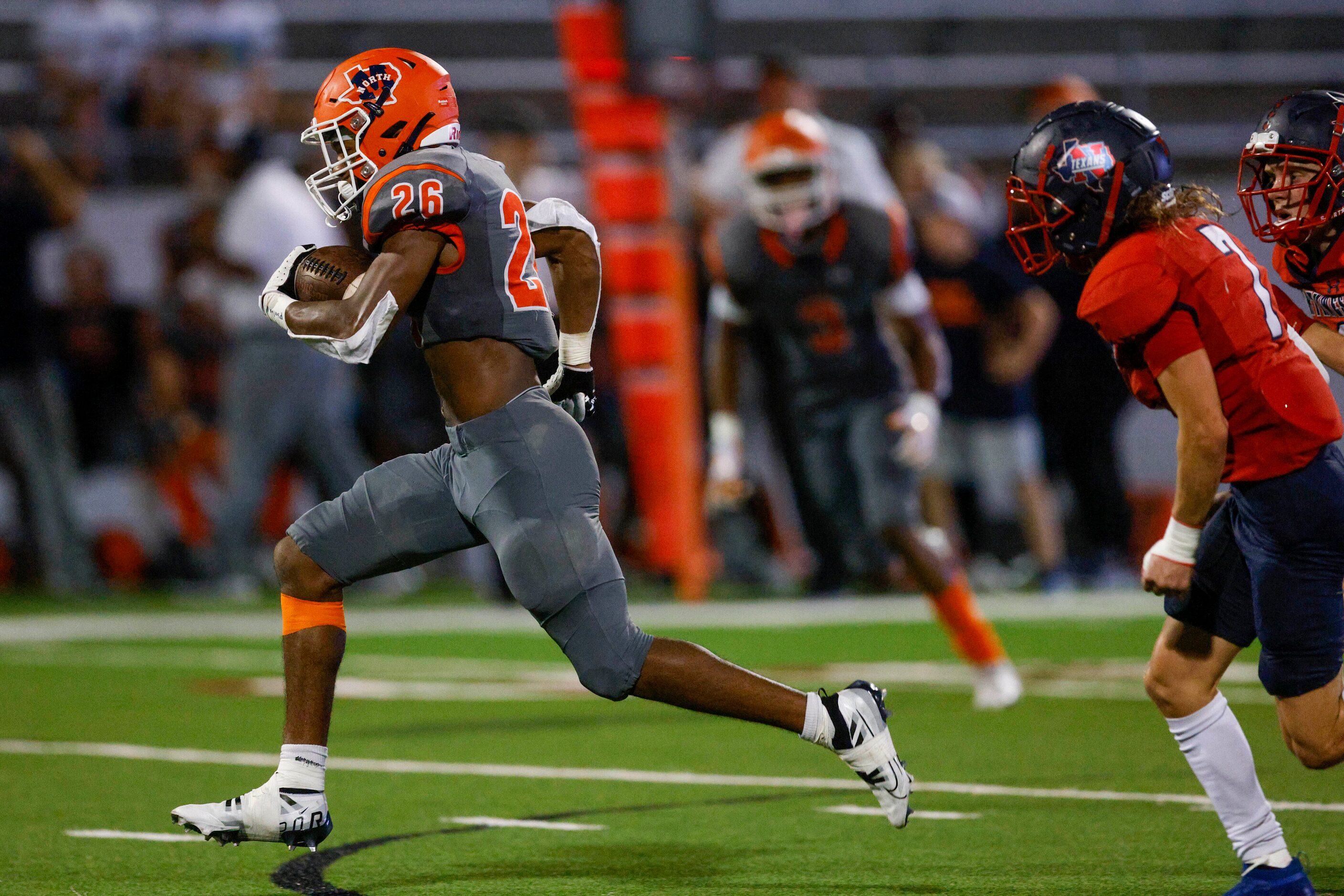 McKinney North running back Jayden Walker (26) runs for a touchdown ahead of Justin...