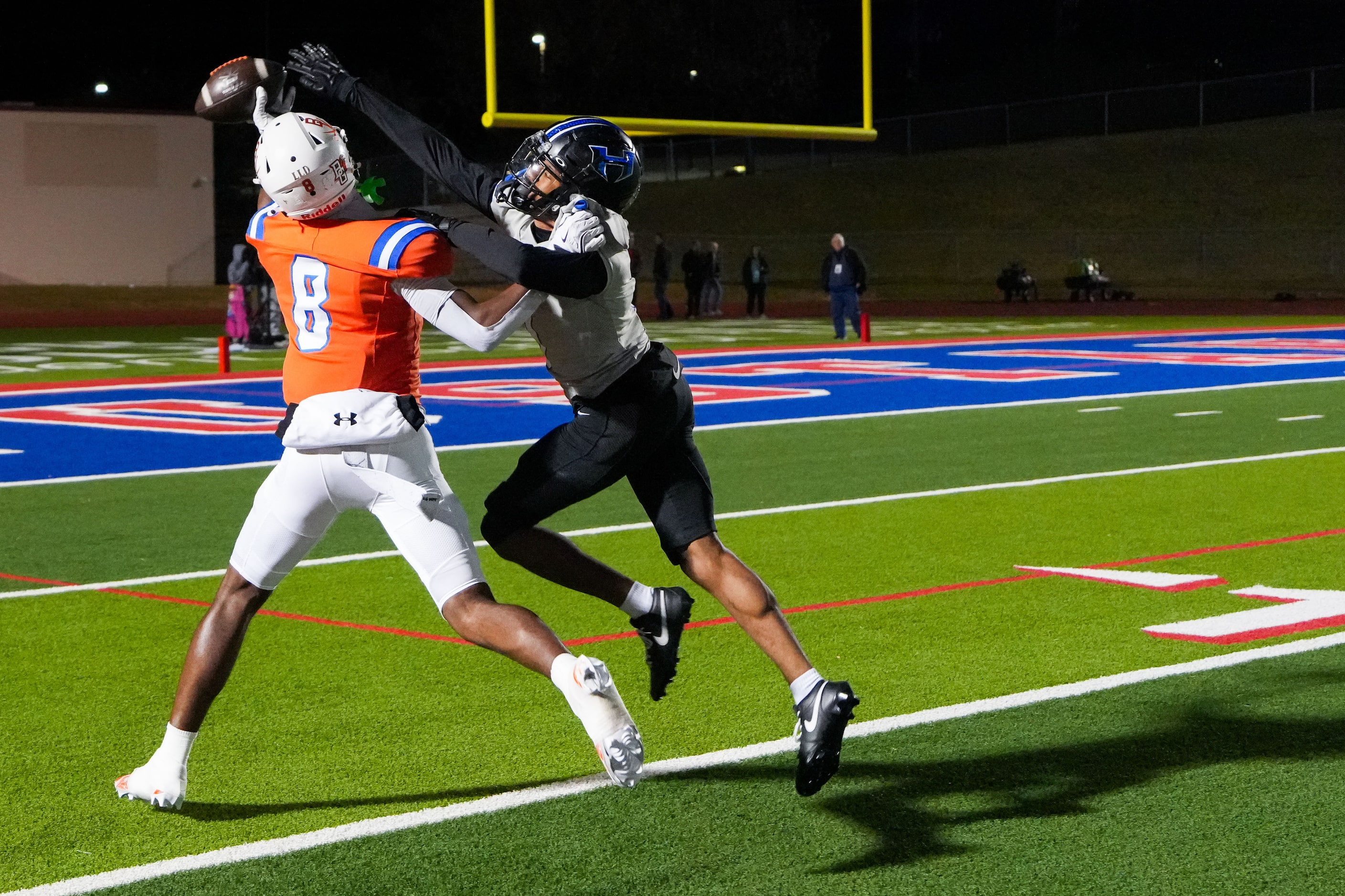 Hebron defensive back Gabriel White (0) breaks up a pass intended for Arlington Bowie wide...