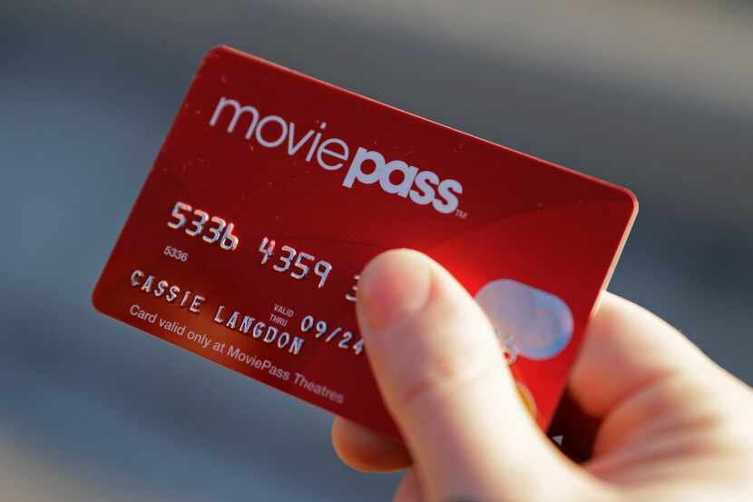 In this Tuesday, Jan. 30, 2018, photo, Cassie Langdon holds her MoviePass card outside AMC...