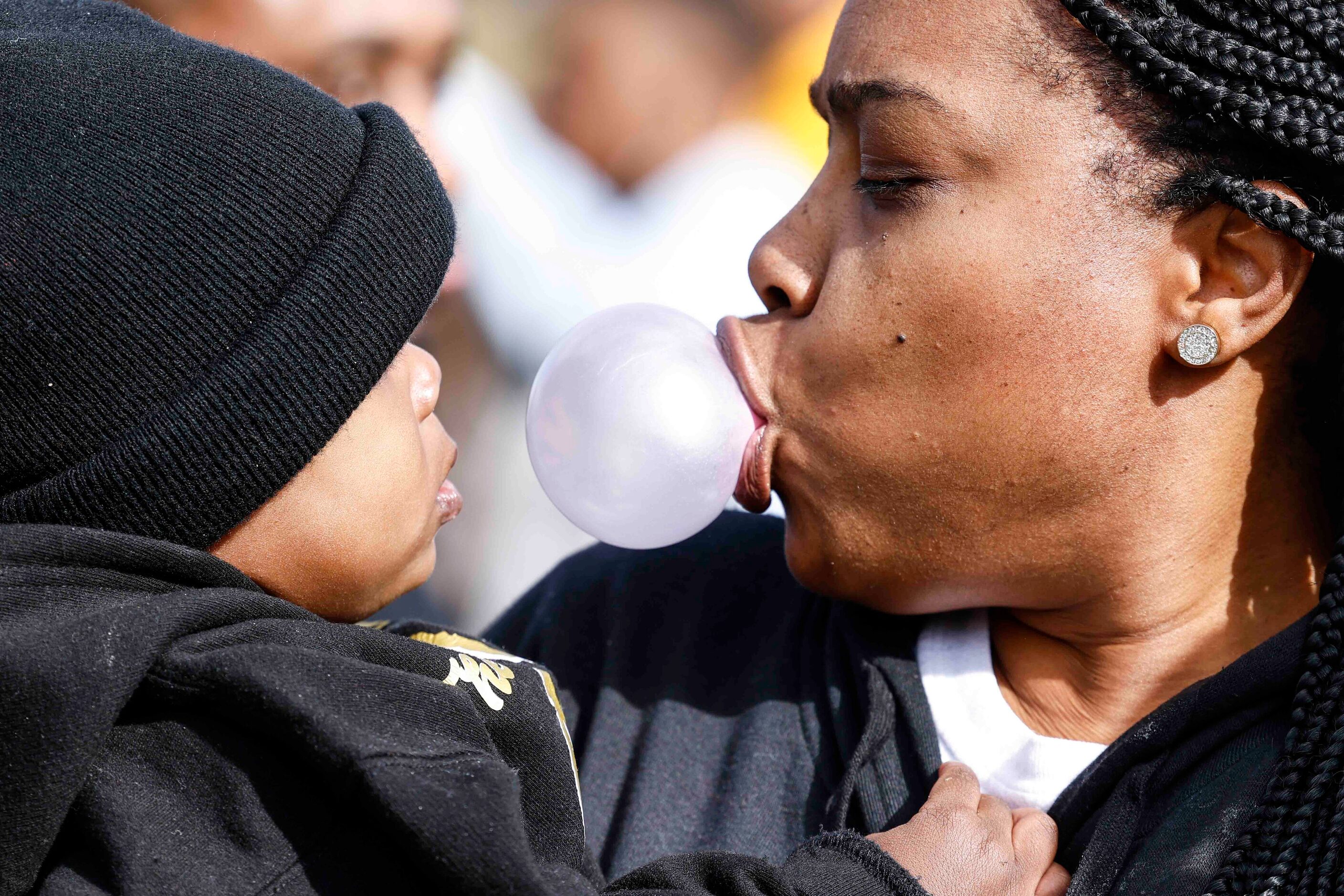 De’Arie Jones, 1, watches his grandmother Shenika McNeal, pop a gum during South Oak Cliff...