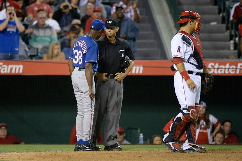 Jun 21, 2014; Anaheim, CA, USA; Texas Rangers manager Ron Washington (38) argues the strike...