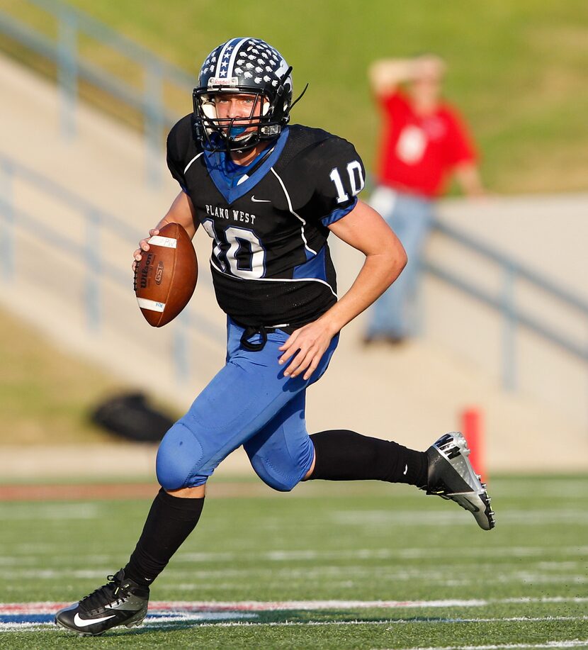 Plano West's Travis Korry (10) scrambles against the Austin Westlake defense in the Class 5A...