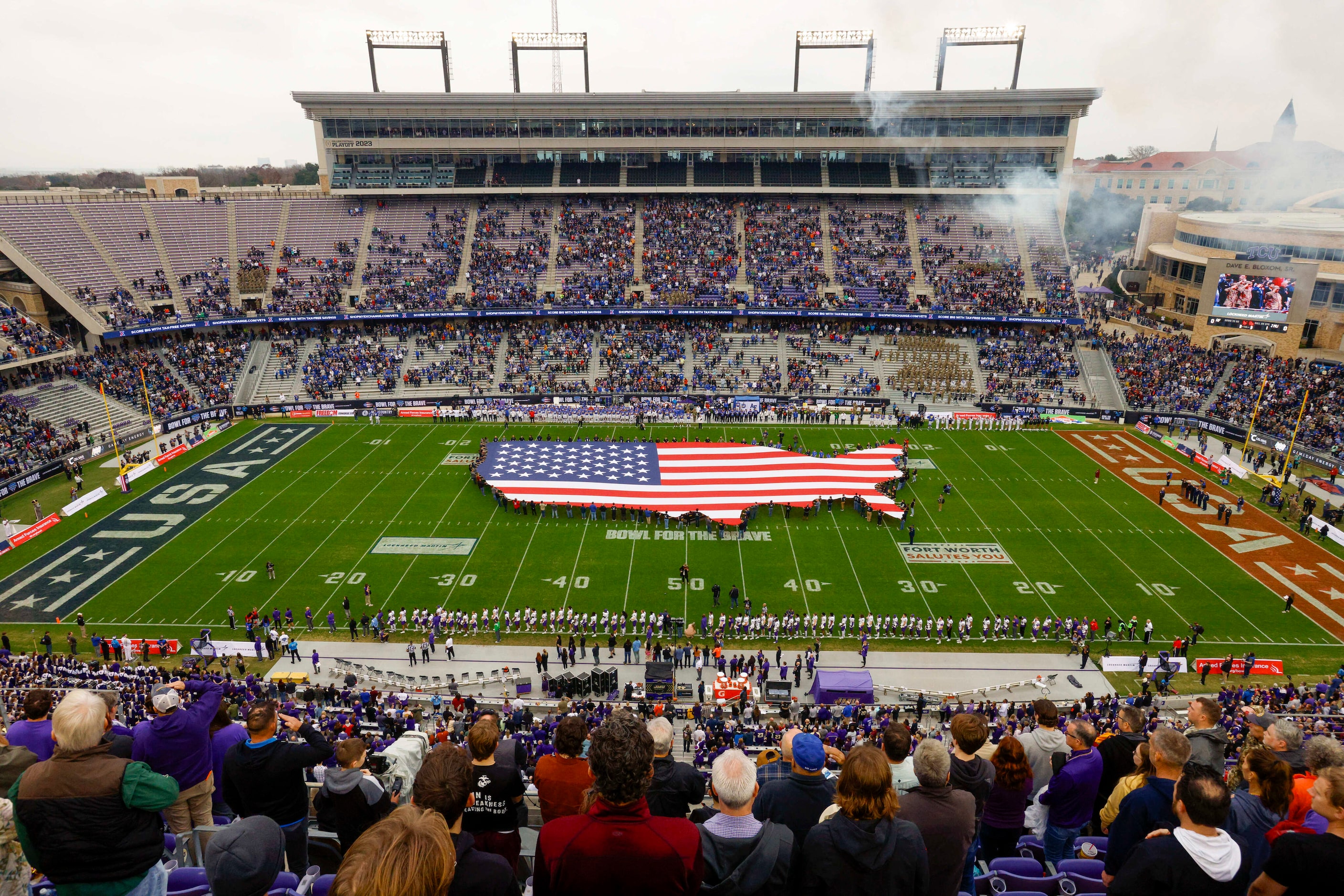 Fans stand for the national anthem before the first half of the Armed Forces Bowl NCAA...