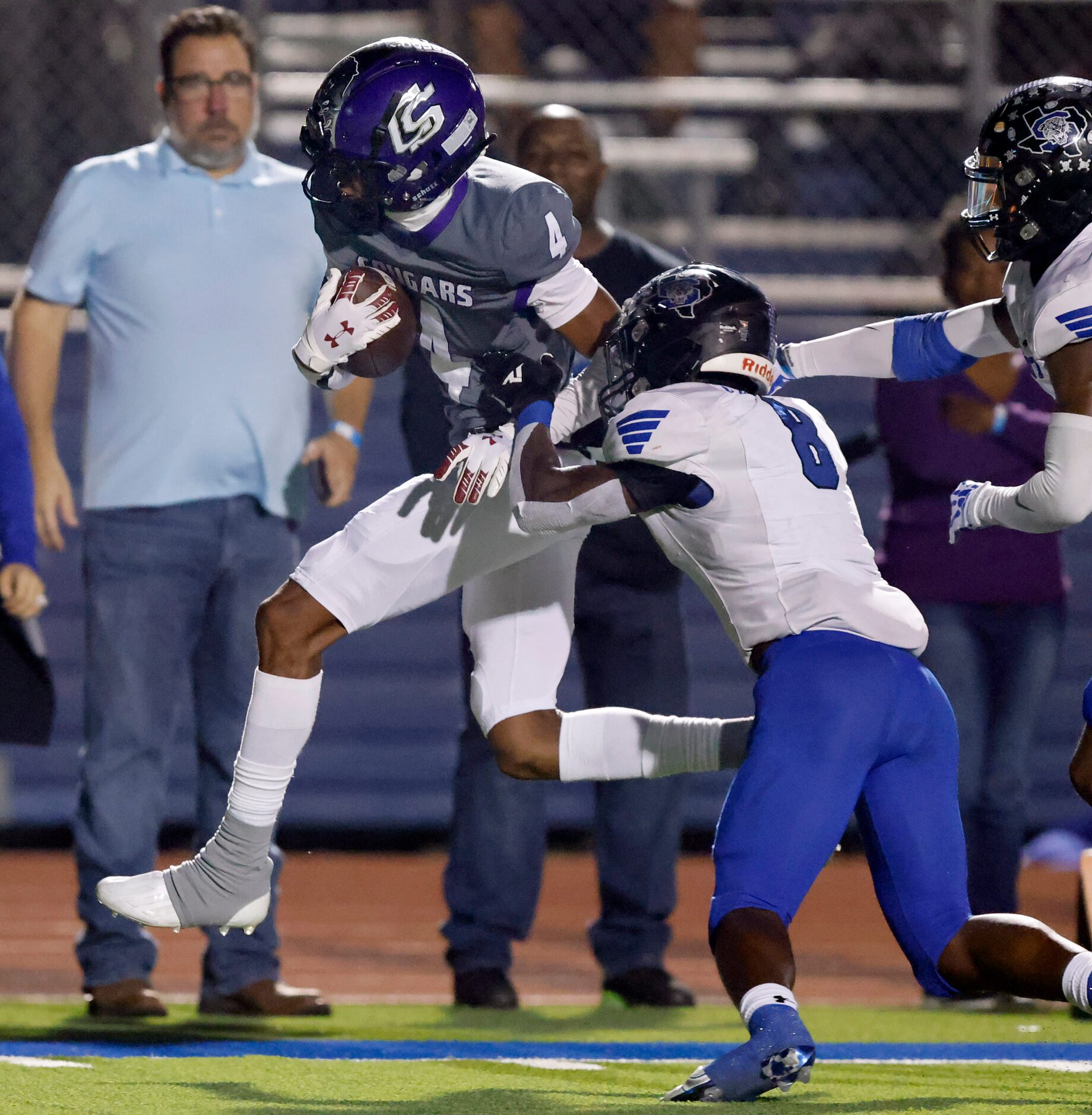 College Station linebacker Denim Day (4) is forced out of bounds by Mansfield Summit Keon...