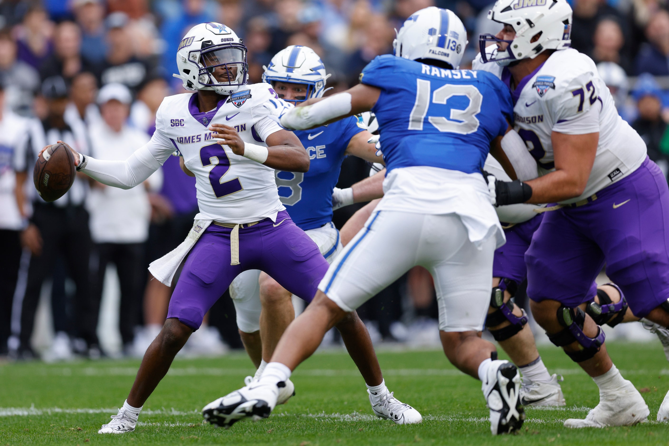 James Madison Dukes quarterback Jordan McCloud (2) throws under pressure from Air Force...