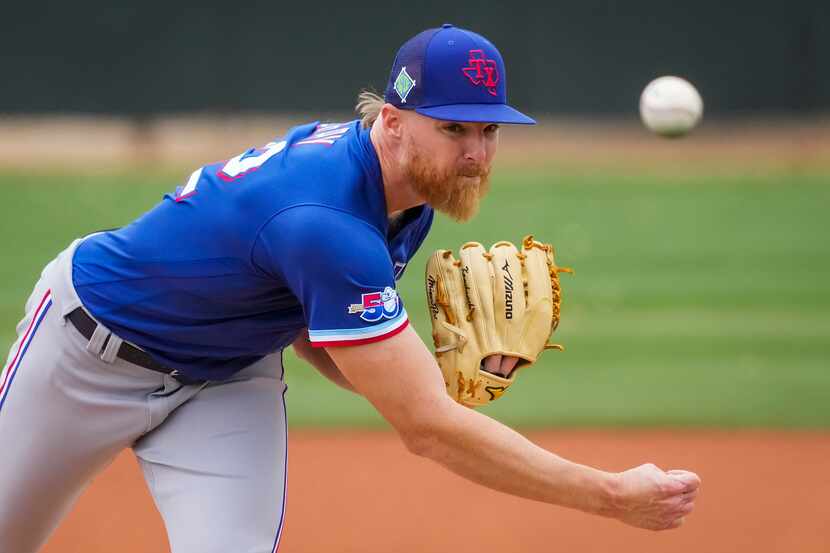 Texas Rangers pitcher Jon Gray throws in a “B” game on the back fields against the Kansas...