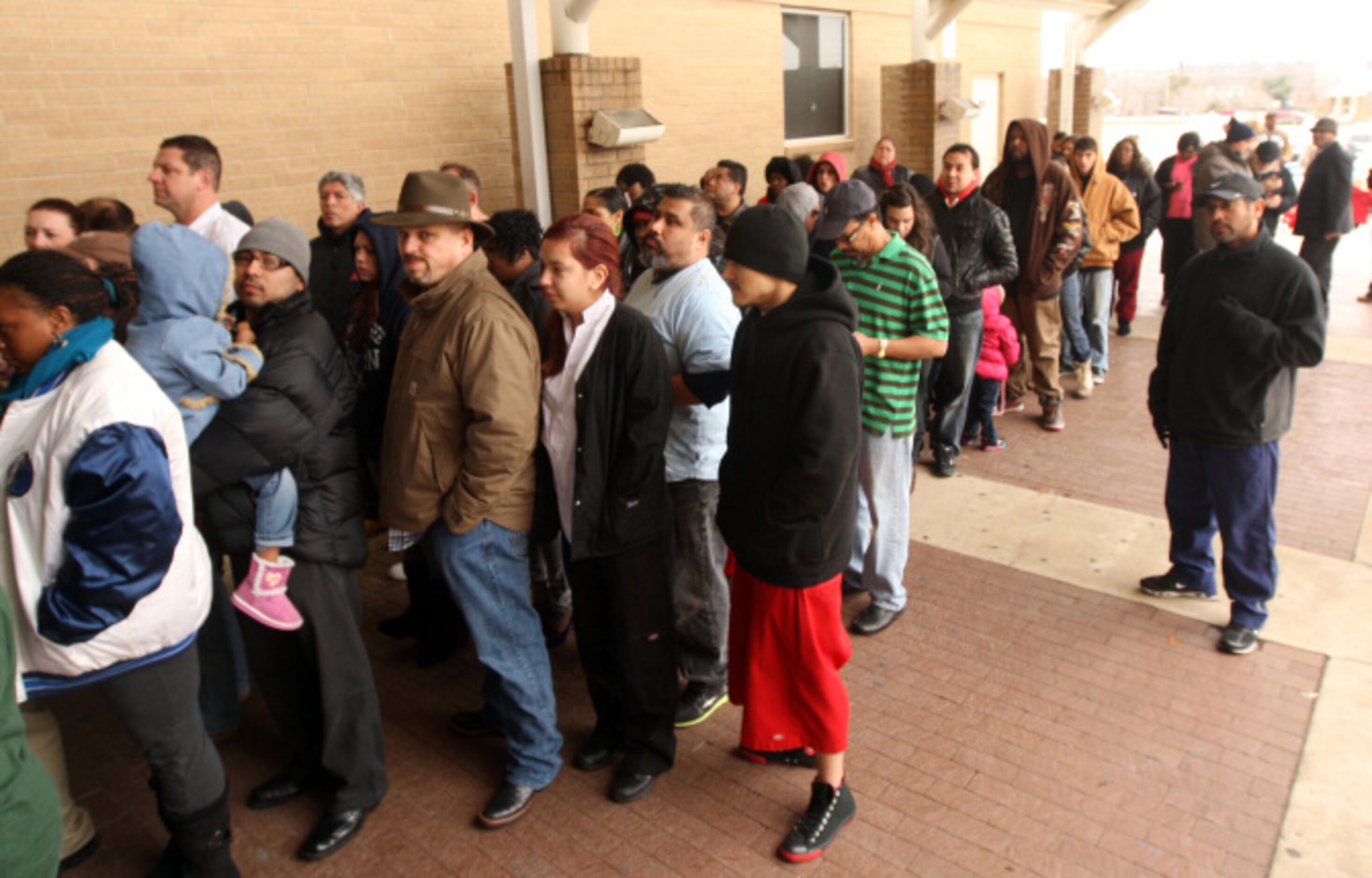 Parents line up to pick up their students after a lockdown at Arlington Lamar High School...