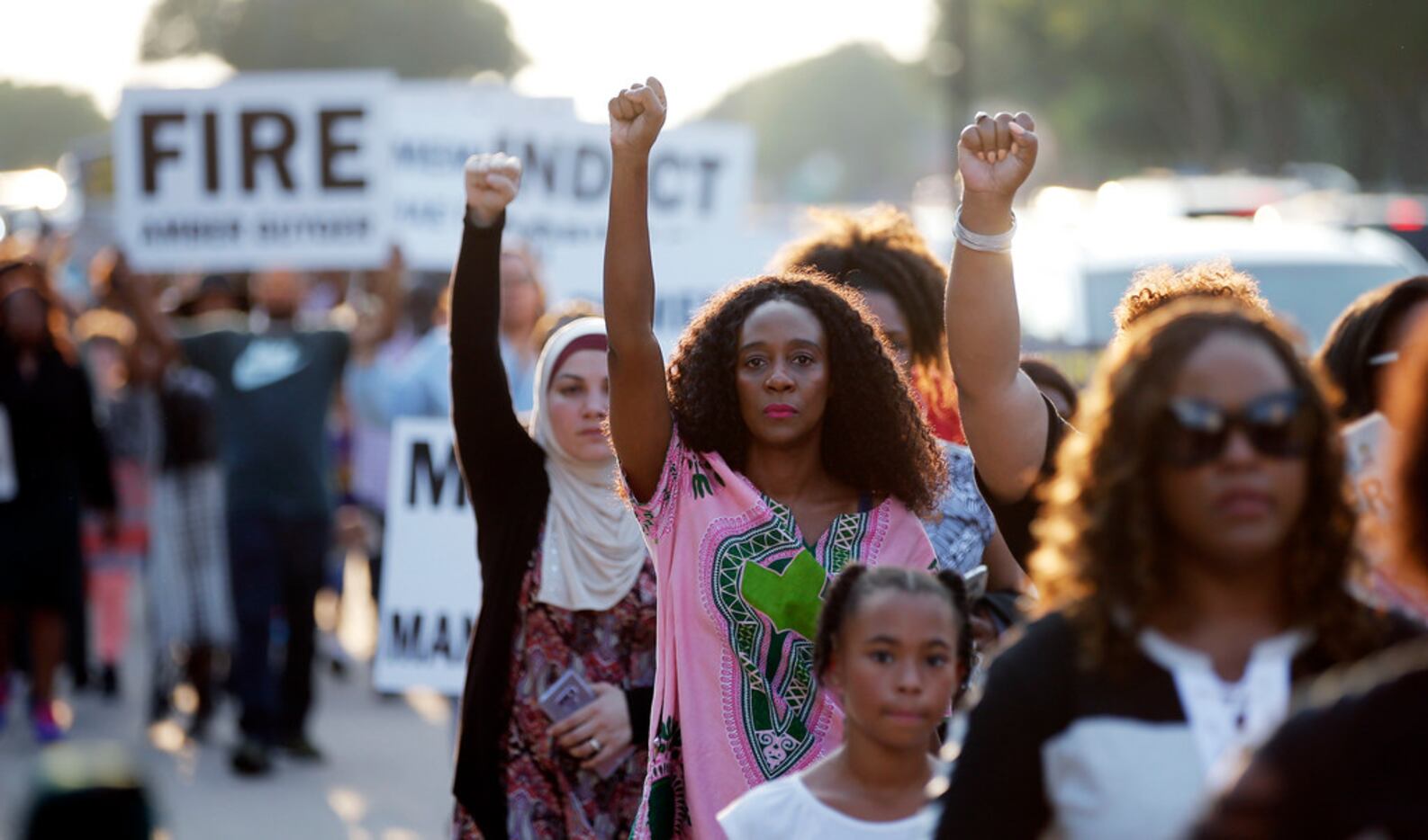 Demonstrators marched outside AT&T Stadium in Arlington before a Dallas Cowboys game in...