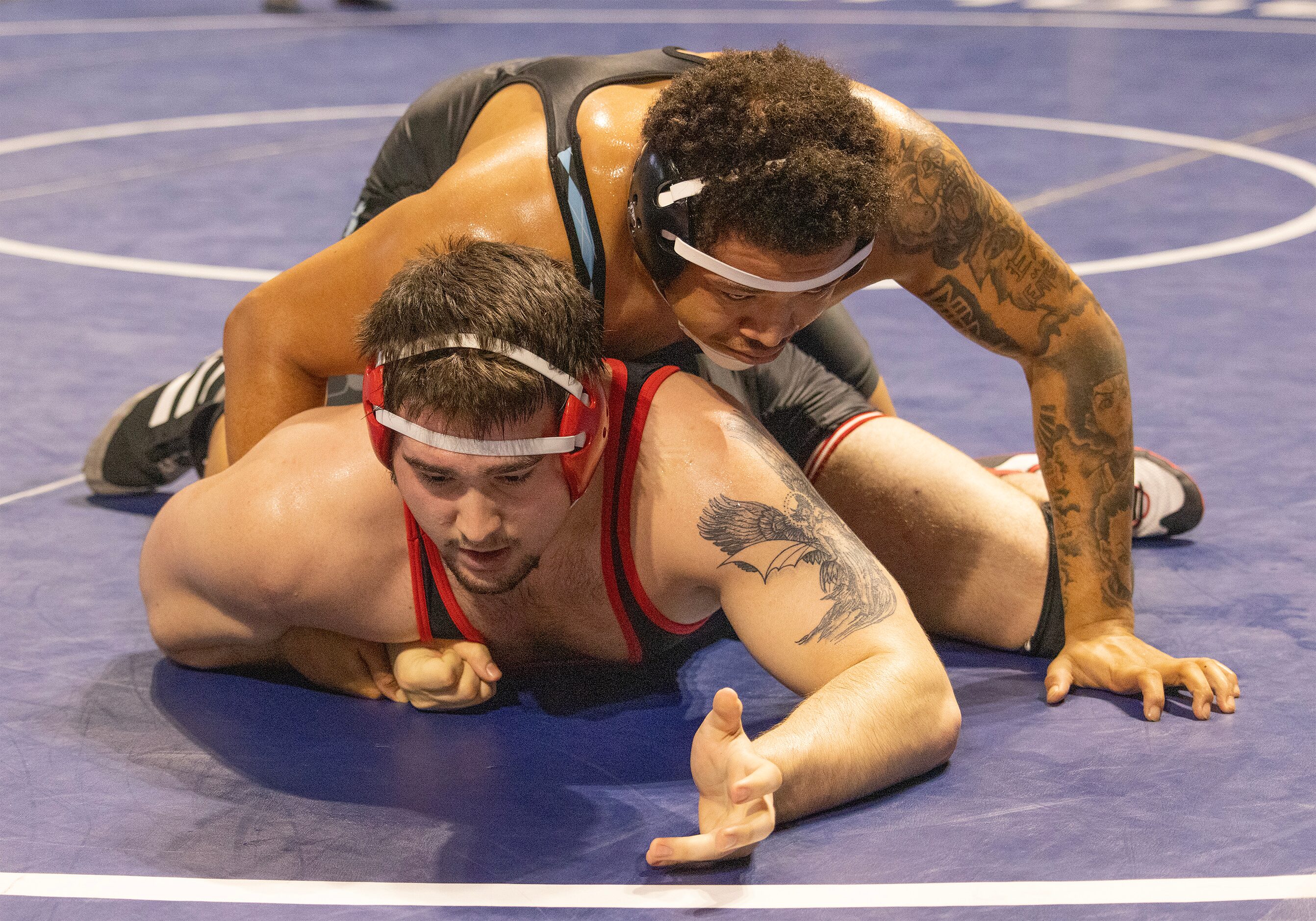 Drake Madole from Allen (bottom) wrestles Jarra Anderson from Katy Paetow in the 6A boys 285...