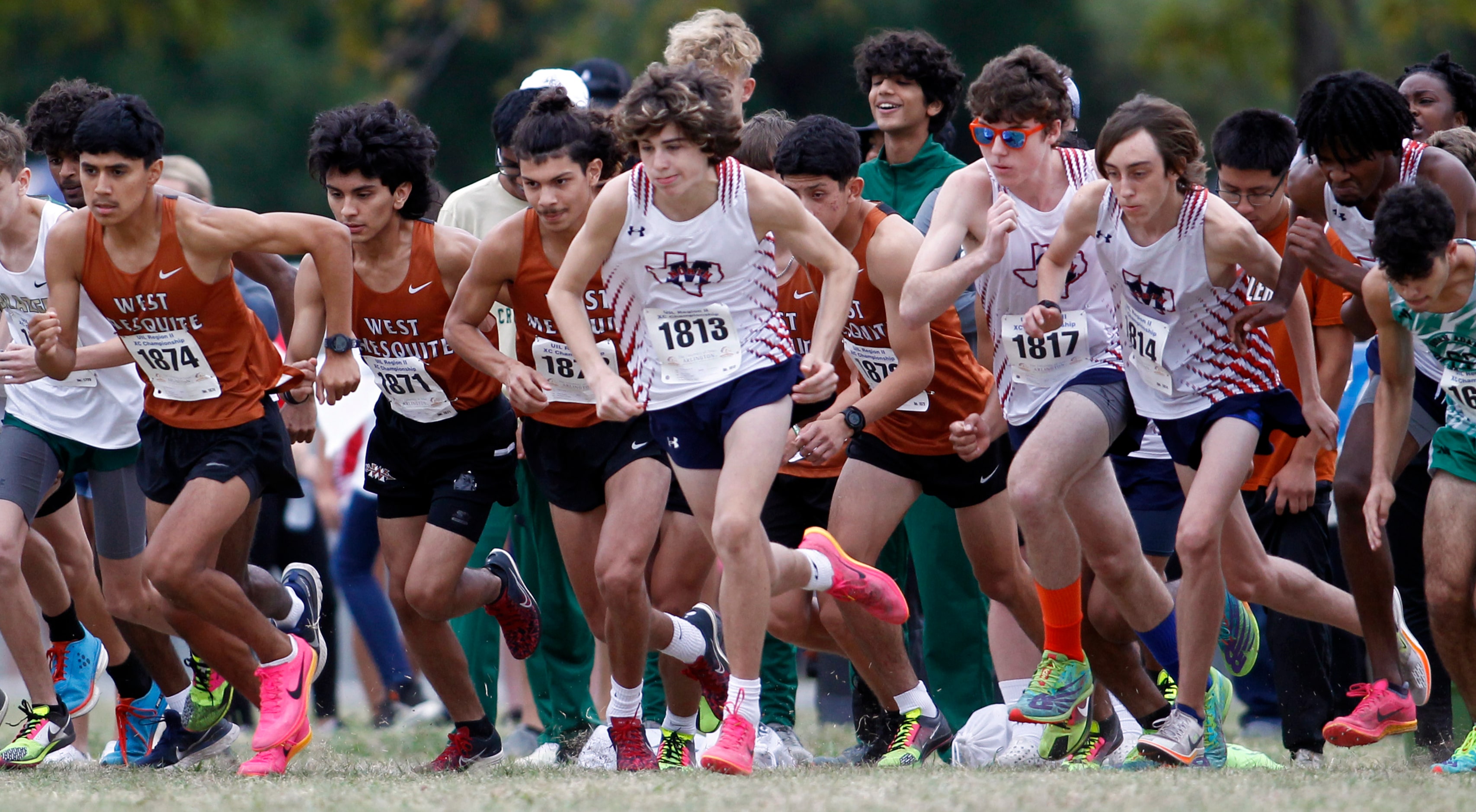 Members of the West Mesquite and McKinney North boys team bolt from the start of the Class...