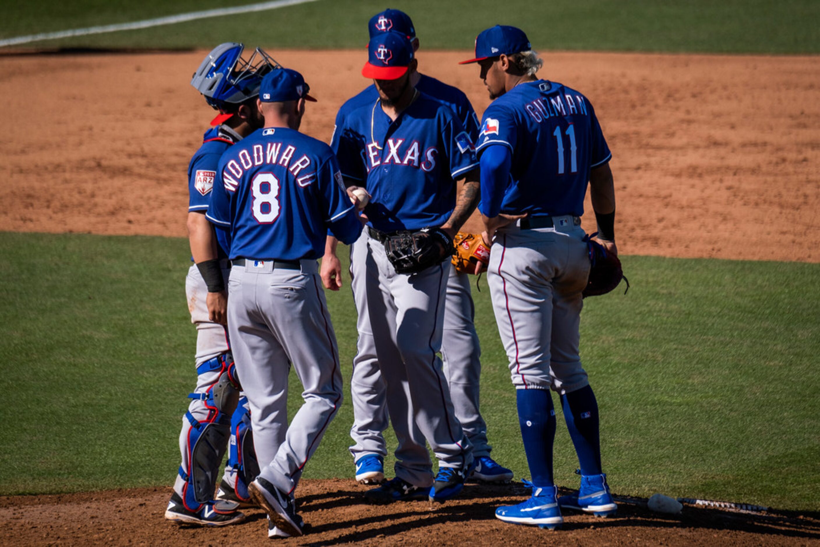 Texas Rangers manager Chris Woodward removes pitcher Jonathan Hernâ¡ndez from the game...