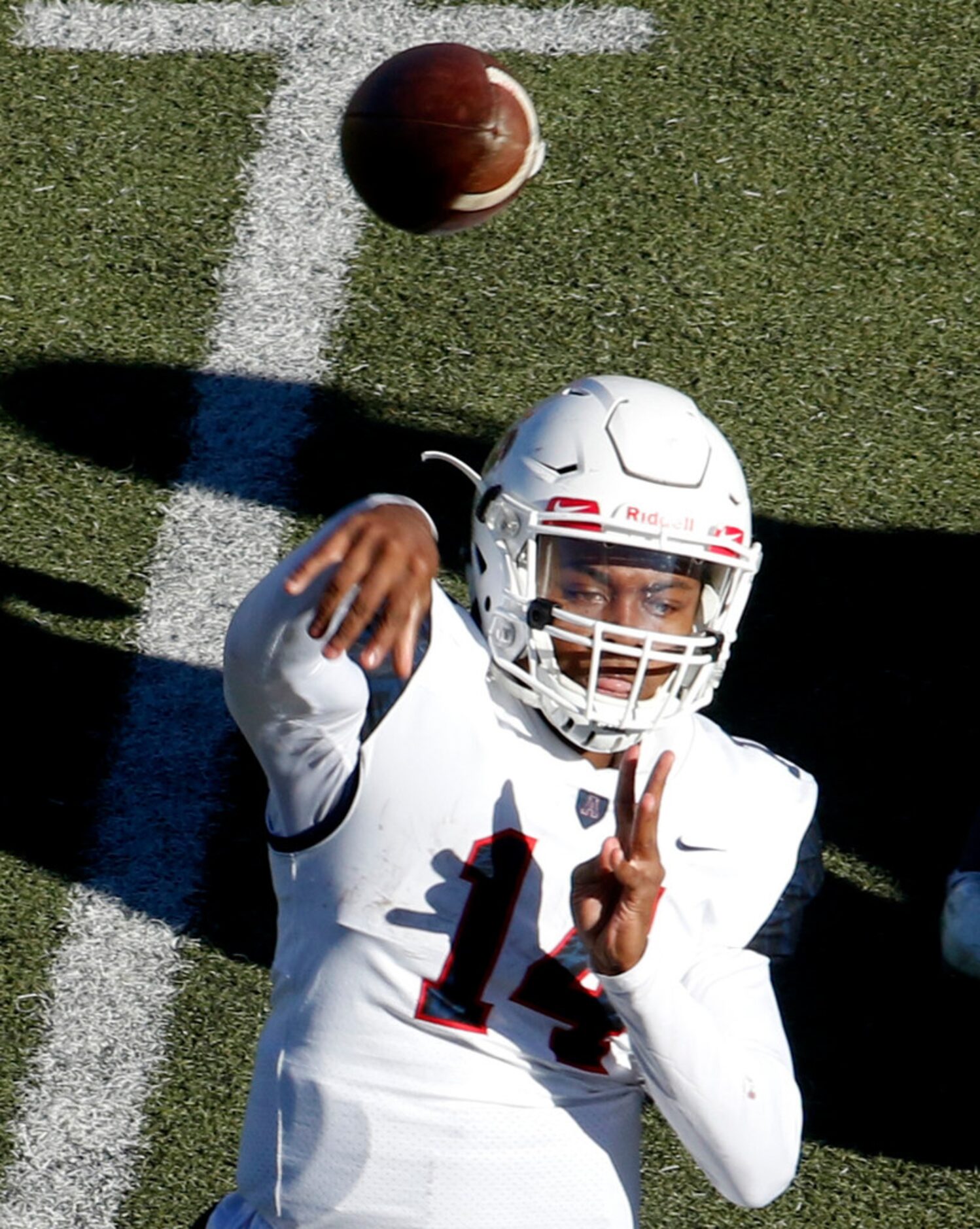 Allen quarterback Grant Tisdale (14) releases a pass during third quarter action against...