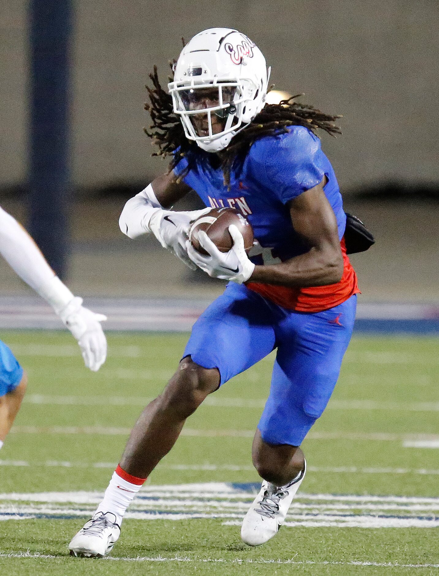 Allen High School wide receiver Messiah Washington (4) looks for room to run during the...