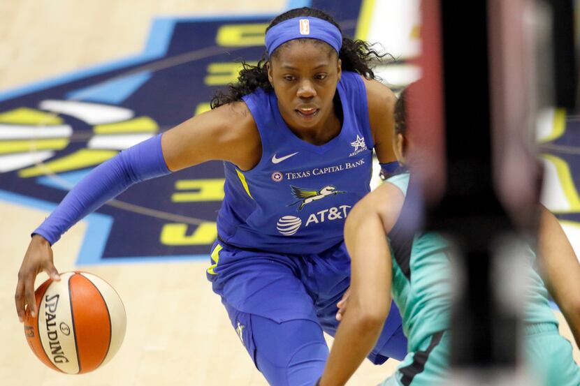 Dallas Wings guard Arike Ogunbowale (24) drives to the basket against a New York Liberty...