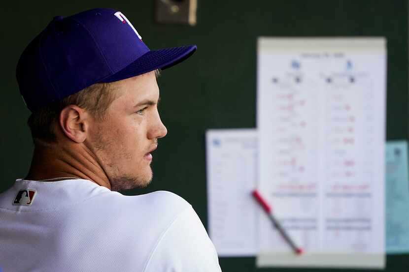 Texas Rangers third baseman Josh Jung looks out from the dugout during the ninth inning of a...