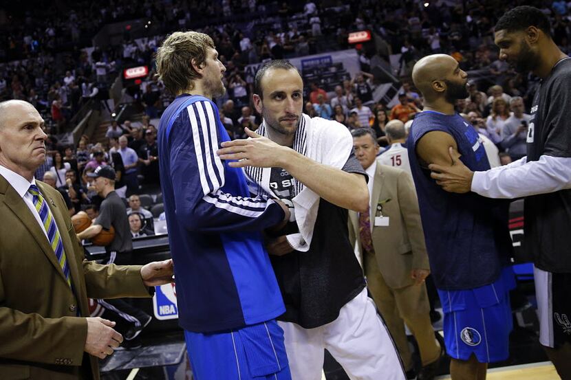 Dallas Mavericks forward Dirk Nowitzki (41) congratulates San Antonio Spurs guard Manu...