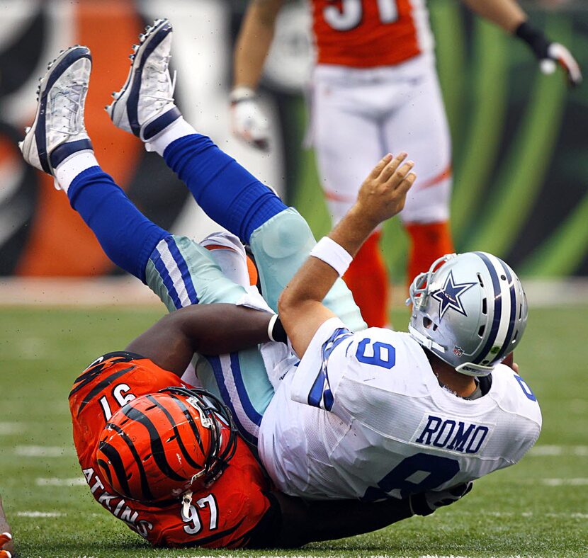 Cincinnati Bengals defensive tackle Geno Atkins (97) sacks Dallas Cowboys quarterback Tony...