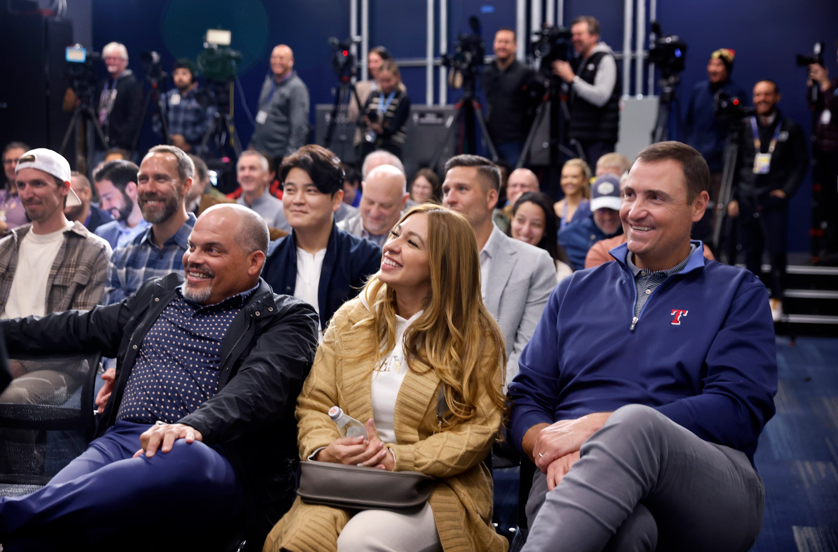 Sandra Beltré, wife of former Texas Rangers third baseman Adrián Beltré (center) laughs as...