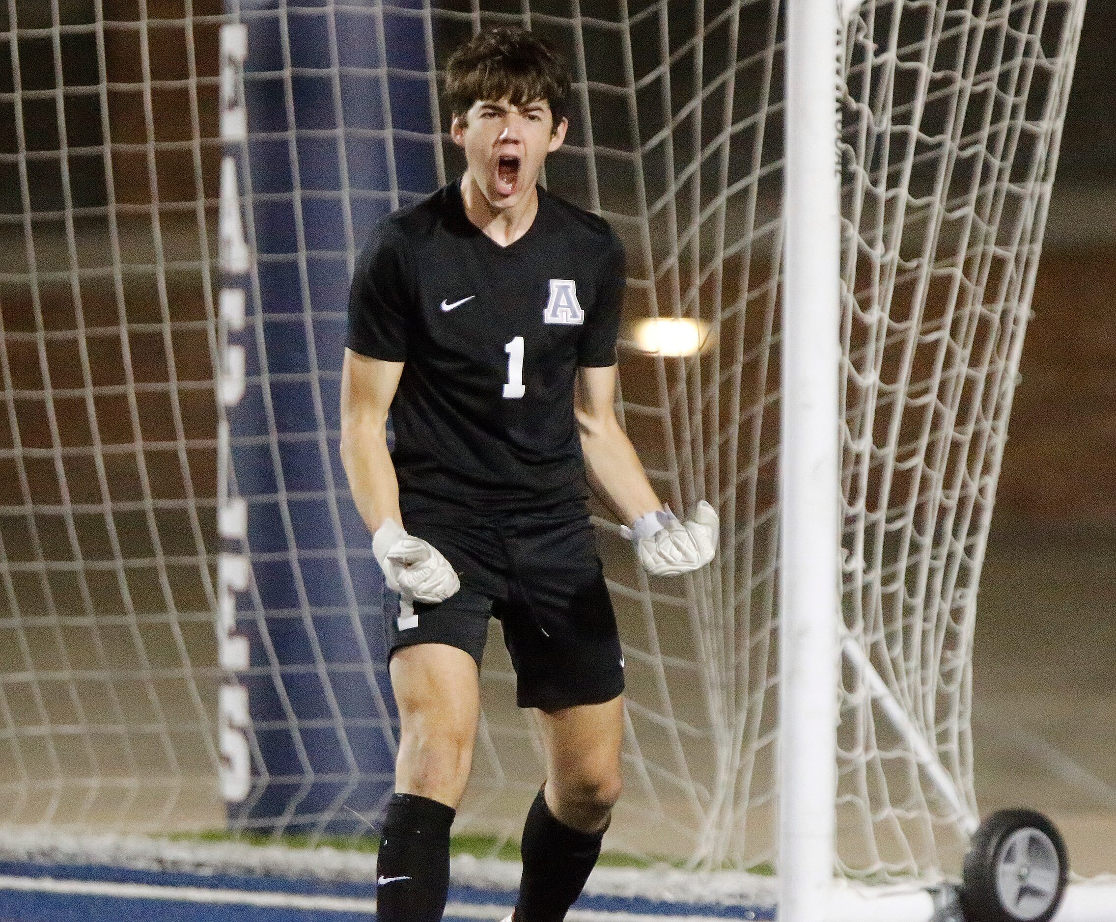 Allen goalkeeper Jackson Leavitt (1) celebrates a stop during the shootout which followed...