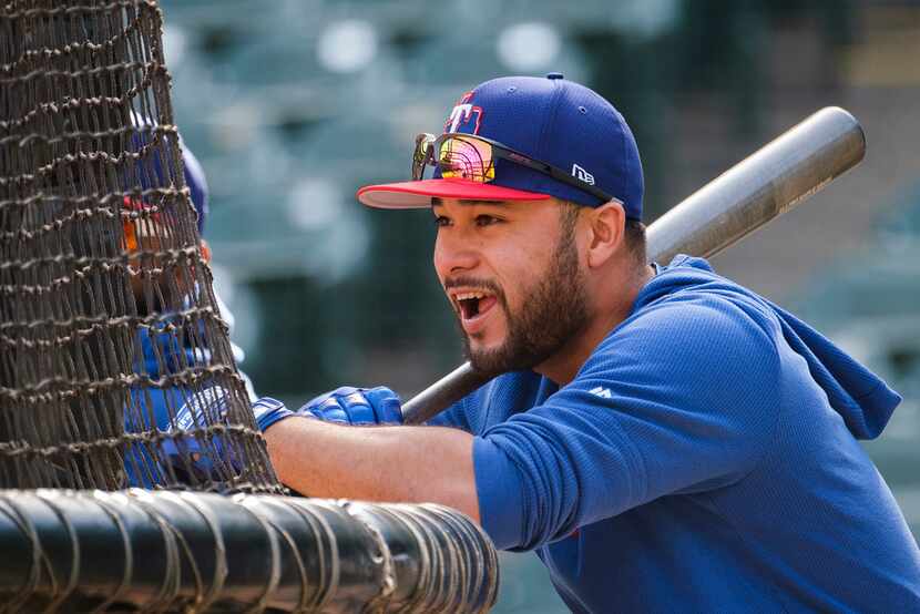 Texas Rangers catcher/infielder Isiah Kiner-Falefa waits between turns in the batting cage...