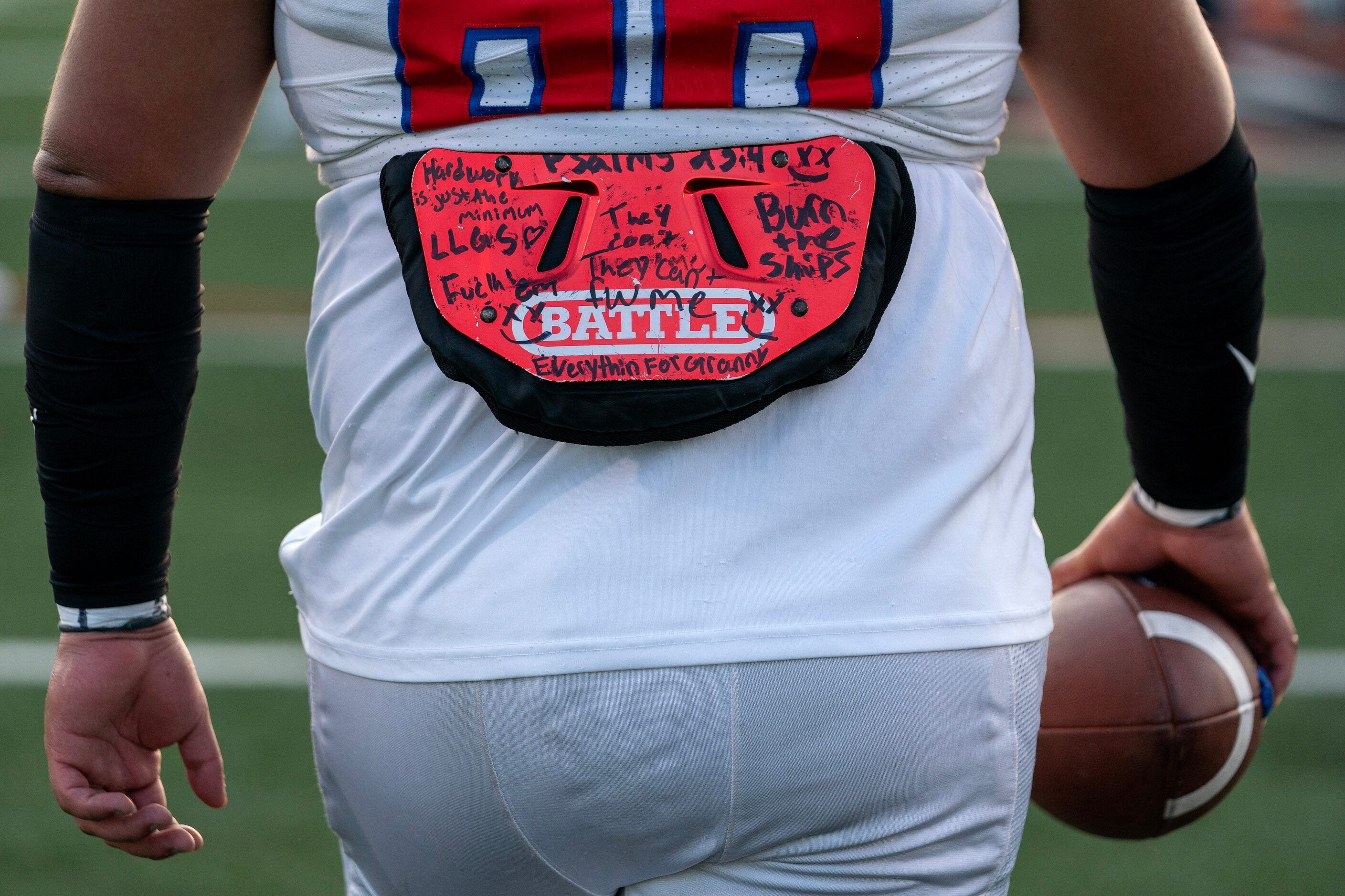 Parish Episcopal senior offensive lineman Jacob Pequeno’s back protector is adorned with...