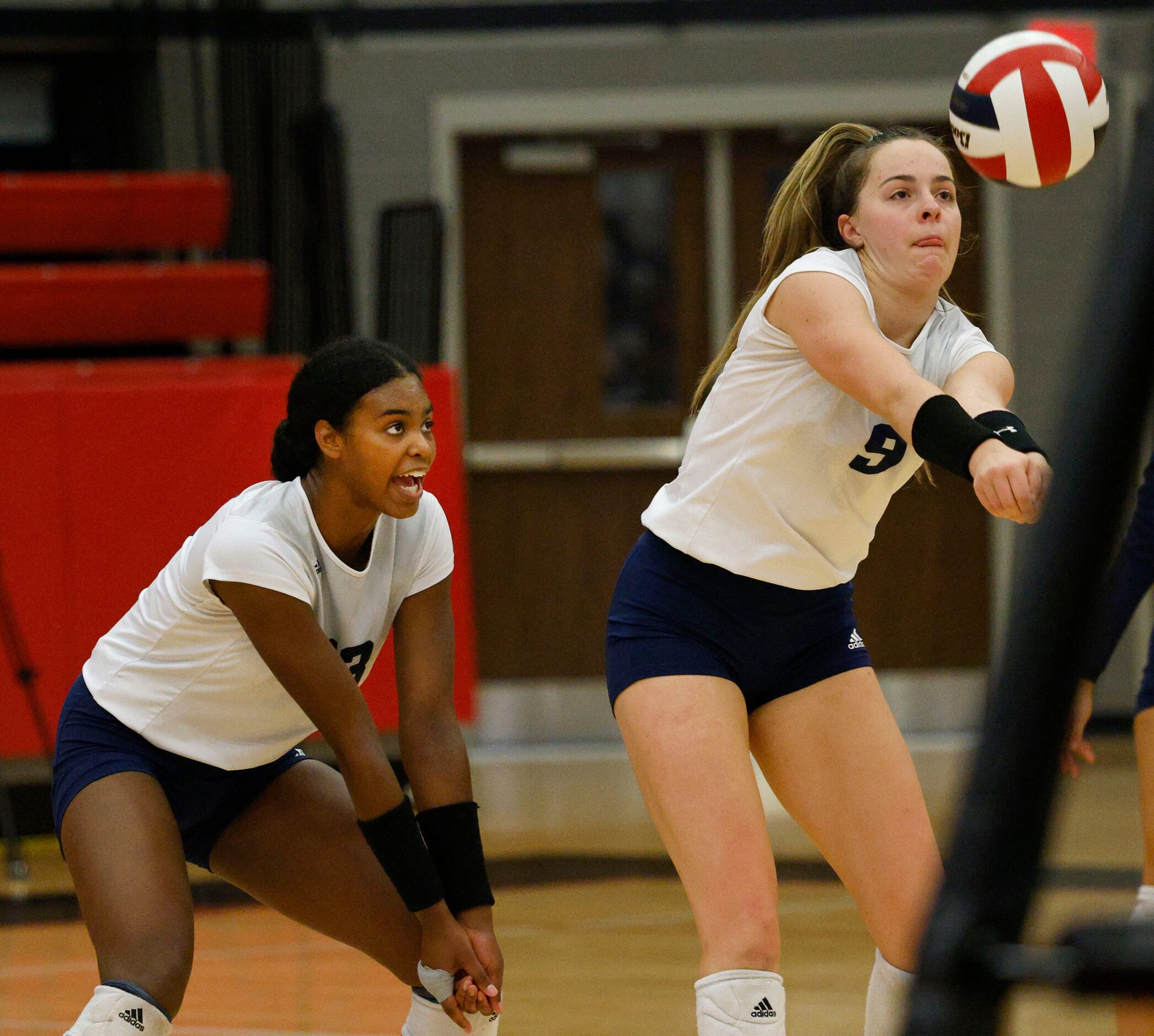 Flower Mound's Cat Young (9), right, digs the ball against Coppell as Flower Mound's Brianna...