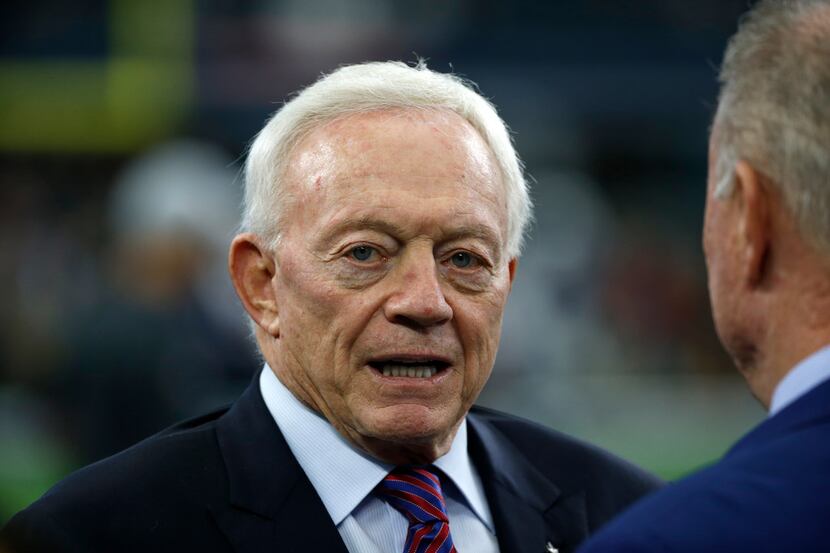 FILE - In this Nov. 23, 2017 file photo, Cowboys owner Jerry Jones stands on the field as...