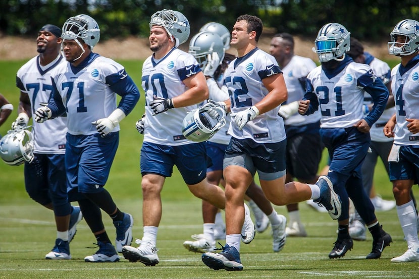 Cowboys offensive linemen Tyron Smith (77, far left), La'el Collins (71), Zack Martin (70)...