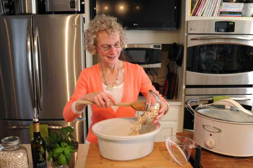 Phyllis Good prepares a white bean casserole for slow-cooking.