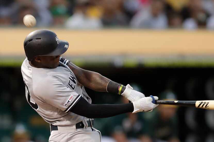 New York Yankees' Cameron Maybin fouls a ball off over his head in the second inning of a...