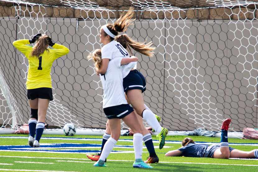A Boerne Champion defender (right) is left on the ground as Highland Park midfielder Frances...