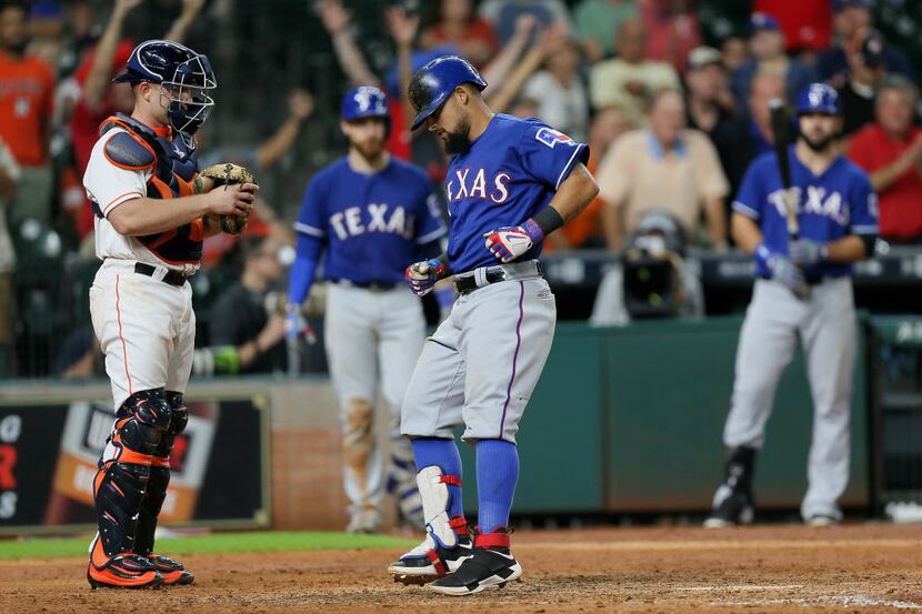 HOUSTON, TX - SEPTEMBER 12:  Rougned Odor #12 of the Texas Rangers crosses the plate after...