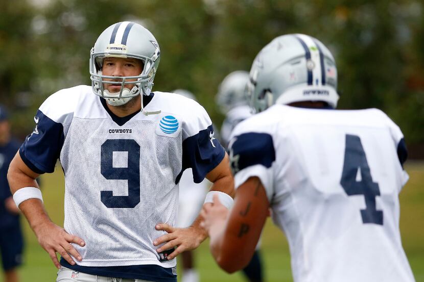 Dallas Cowboys quarterbacks Tony Romo (9) and Dak Prescott (4) practice at Ford Center at...