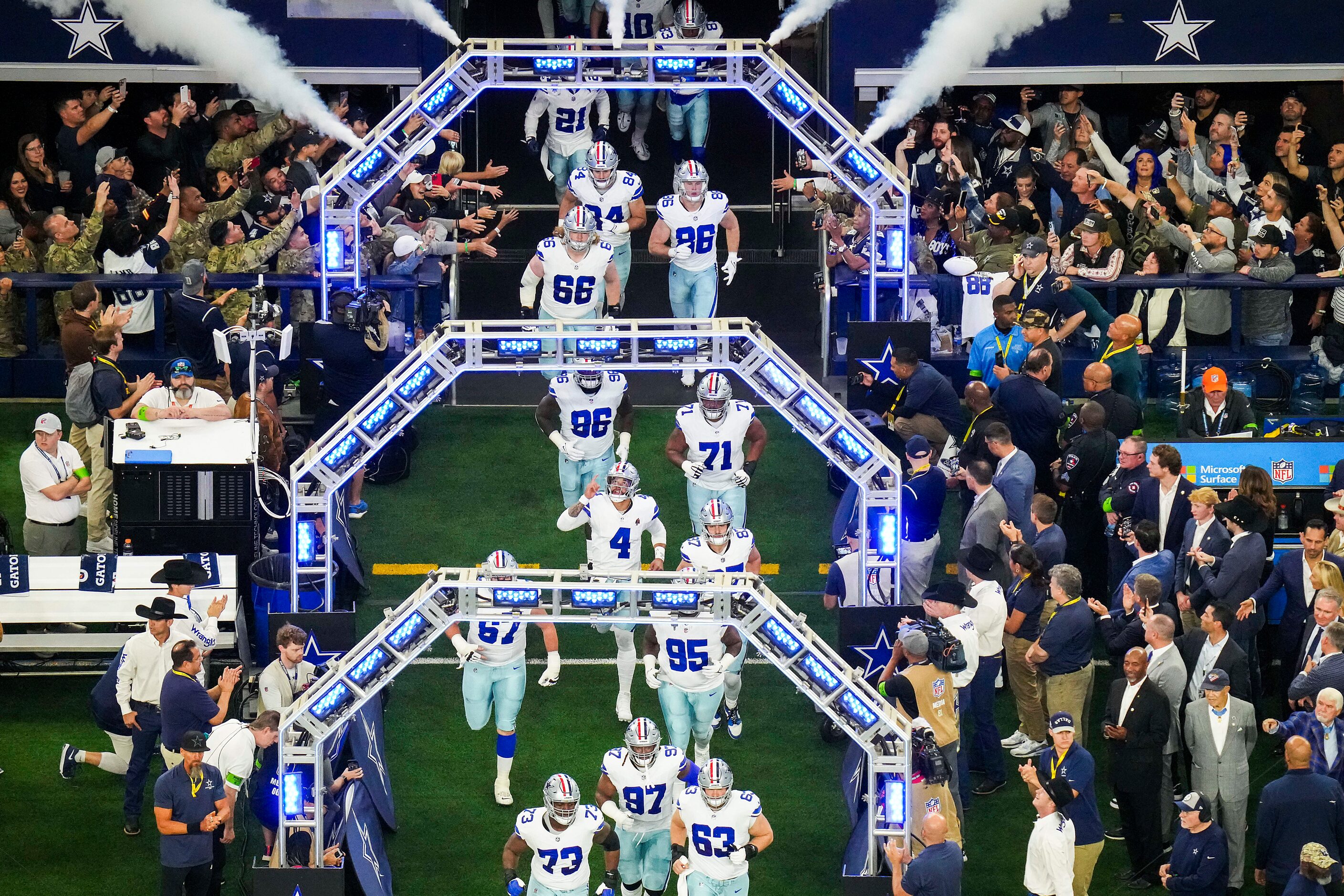 Dallas Cowboys quarterback Dak Prescott (4) points skyward as the team takes the field...