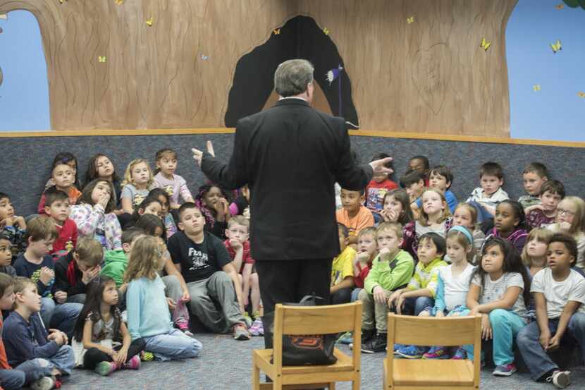 Wylie Mayor Mayor Hogue talks with first graders at R. F. Hartman Elementary School. The...