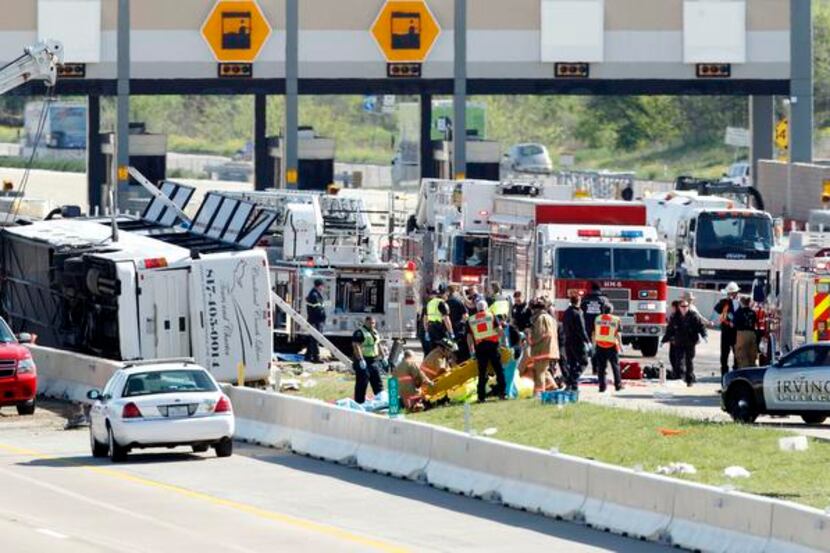 
First responders on the scene of a Cardinal Coach Line charter bus accident on Highway. 161...