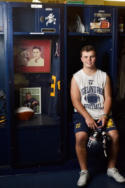 Highland Park senior running back Doak Walker sits next to the tribute locker to his...