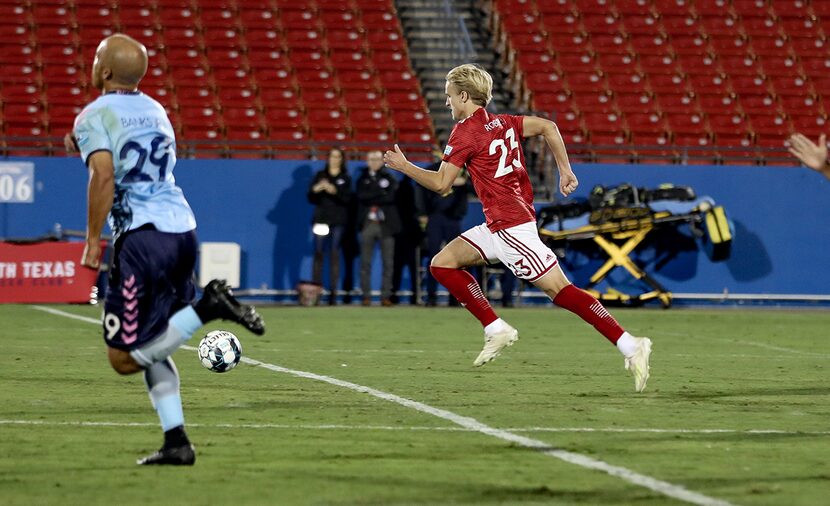 Thomas Roberts dribbles upfield against Forward Madison in North Texas SC's semifinal...