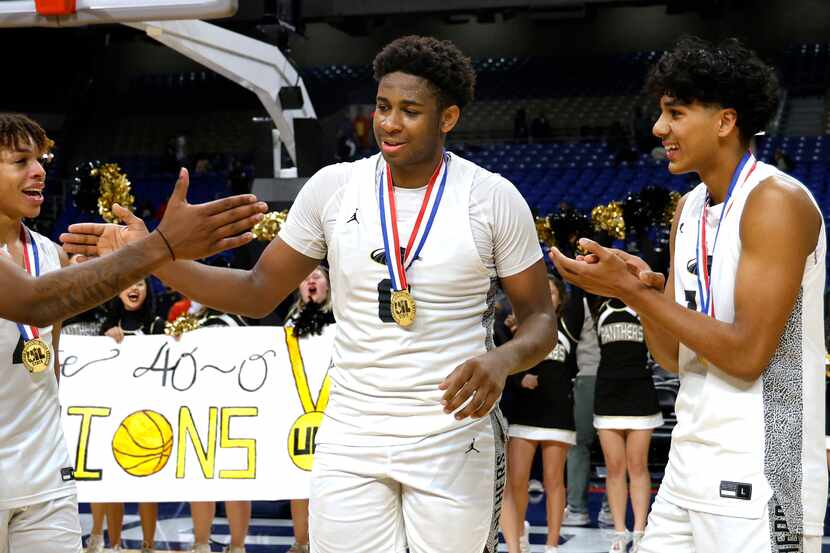 Plano East Panthers DJ Hall (0) is congratulated after it was announced he won the MVP...