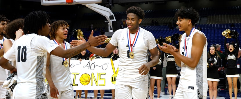 Plano East Panthers DJ Hall (0) is congratulated after it was announced he won the MVP...