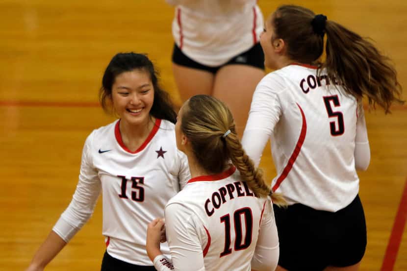 Coppell's Stella Yan (15) was all smiles as she celebrates with teammates Kinsey Bailey (10)...