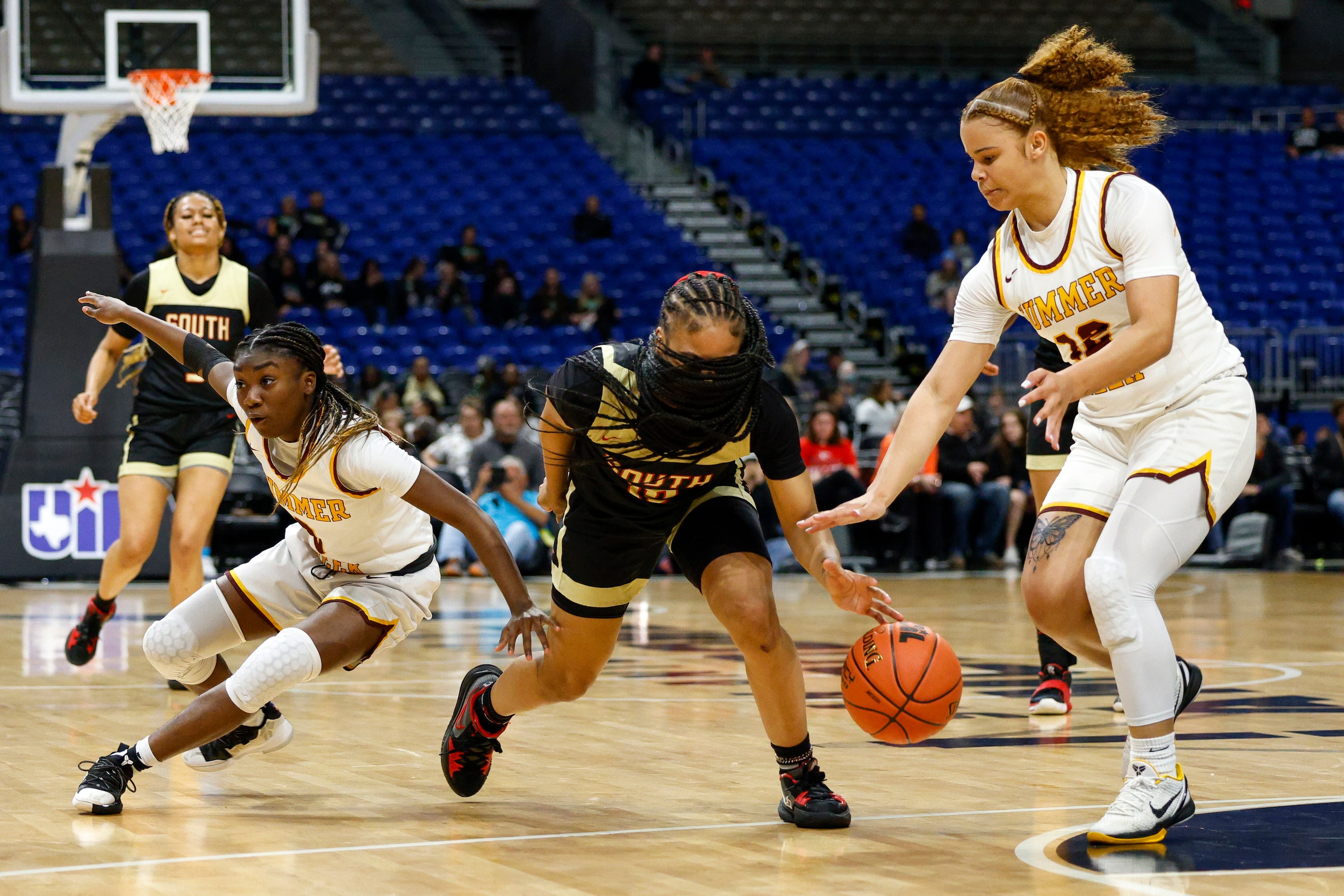 South Grand Prairie guard Victoria Dixon (10) reaches for a loose ball in front of Humble...