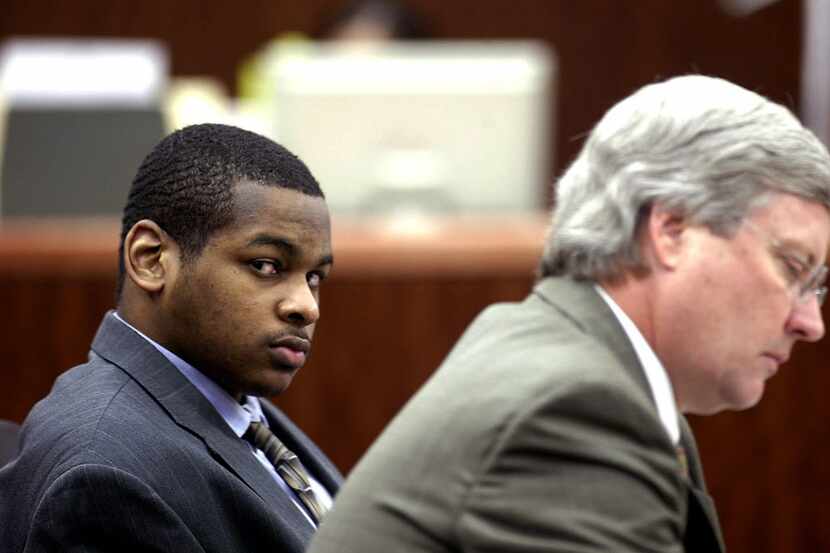 In this Oct. 10, 2005 file photo, Alfred Dewayne Brown (left) is seated next to defense...