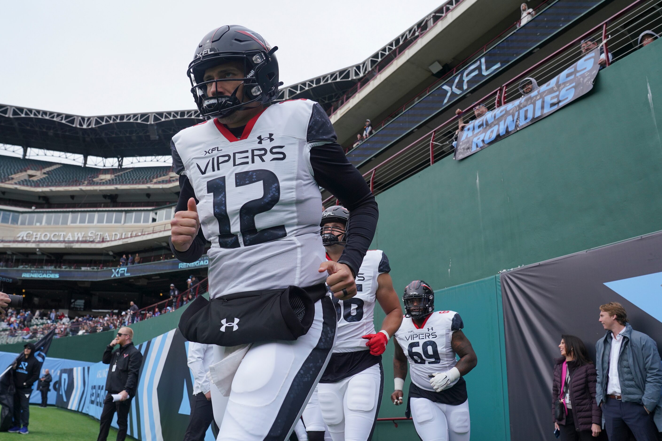 Vegas Vipers quarterback Luis Perez (12) runs onto the field before an XFL football game...