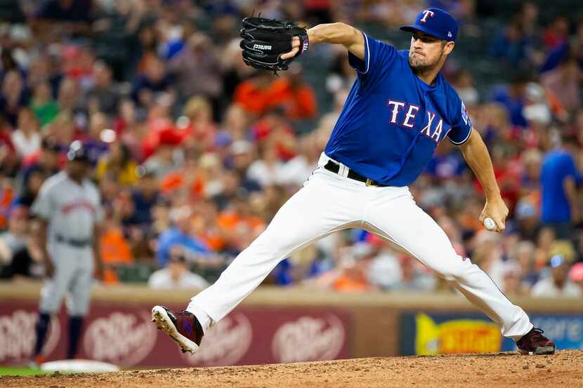 Texas Rangers starting pitcher Cole Hamels pitches during the eighth inning against the...